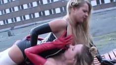 Naughty lesbians Petra and Sabine please each other's pussies outside