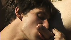 Sexy studs with big dicks give each other a stuffing outdoors